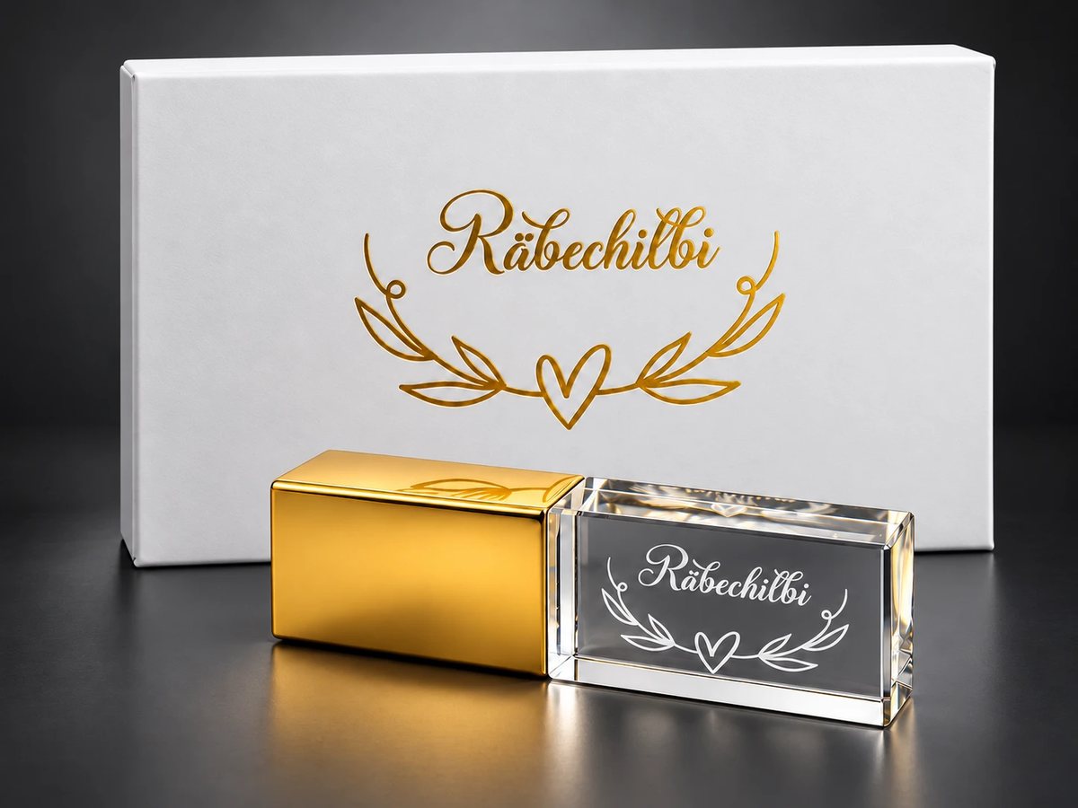 Gravierter Glasstick mit goldfarbener Kappe und weisser Räbechilbi-Geschenkbox